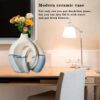 The handcrafted vase is designed with a unique scene - Image 11
