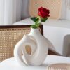 The handcrafted vase is designed with a unique scene - Image 8